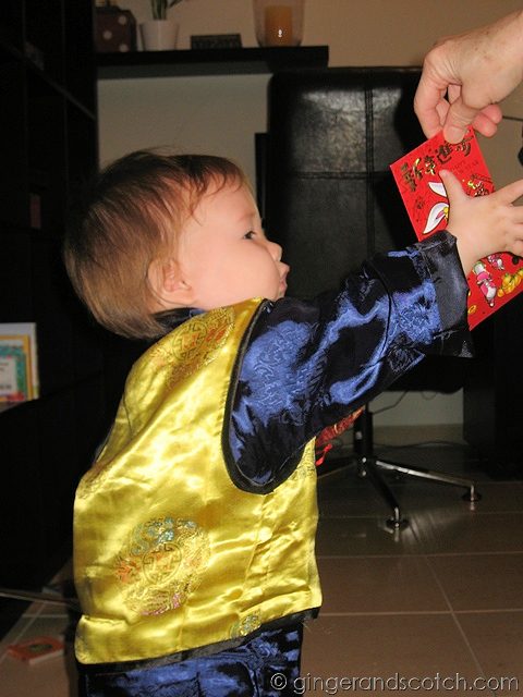Wee Scotch getting lucky money from Grandma