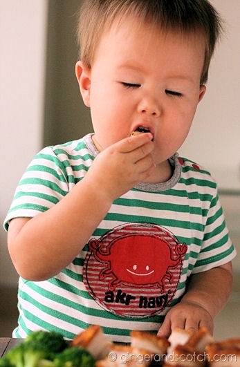 closing his eyes to capture the first taste of pork crackling